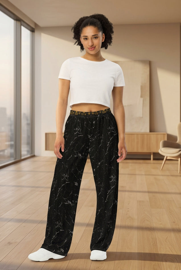 V.I.M black skull marble wide-leg pants draped over a sofa