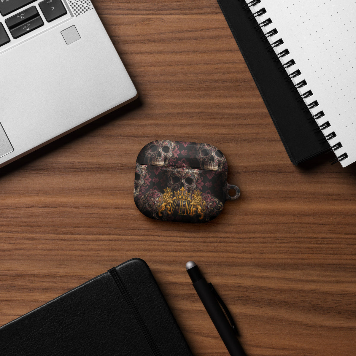 Velvet Ink Market Ornate Skull & Gold Crest AirPods Case, front view featuring ornate skulls and a gold VIM crest (additional photo 5).