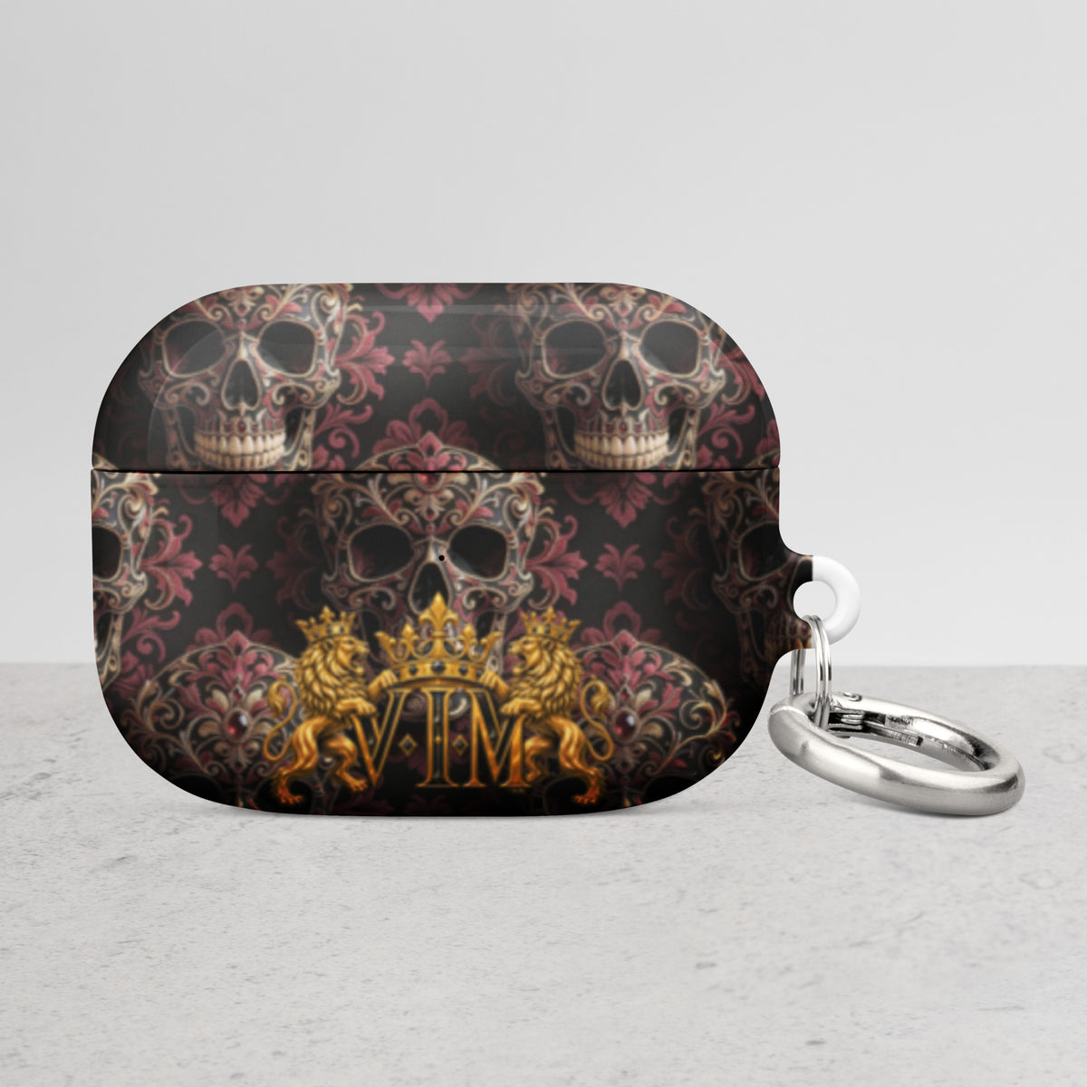 Velvet Ink Market Ornate Skull & Gold Crest AirPods Case, front view featuring ornate skulls and a gold VIM crest (additional photo 2).