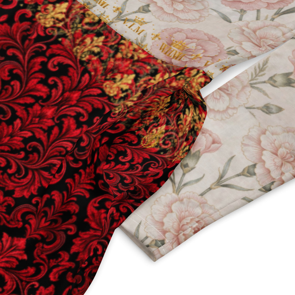 Two folded fabric pieces displayed diagonally on a white background. The left fabric has a rich red and black baroque damask pattern with gold accents, while the right fabric features a light pink and beige floral print with gold lettering.