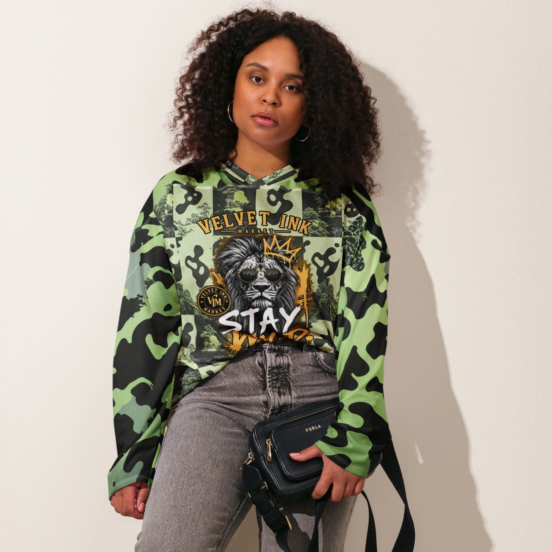 Velvet Ink Market Stay Wild Lion Green Camo Hockey Fan Jersey, front view featuring a crowned lion with sunglasses on green camouflage (additional photo 4).