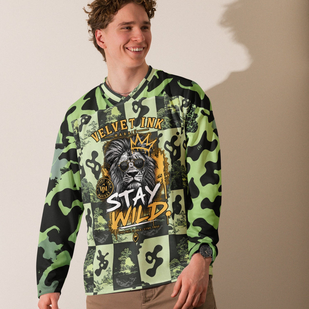 Velvet Ink Market Stay Wild Lion Green Camo Hockey Fan Jersey, front view featuring a crowned lion with sunglasses on green camouflage.