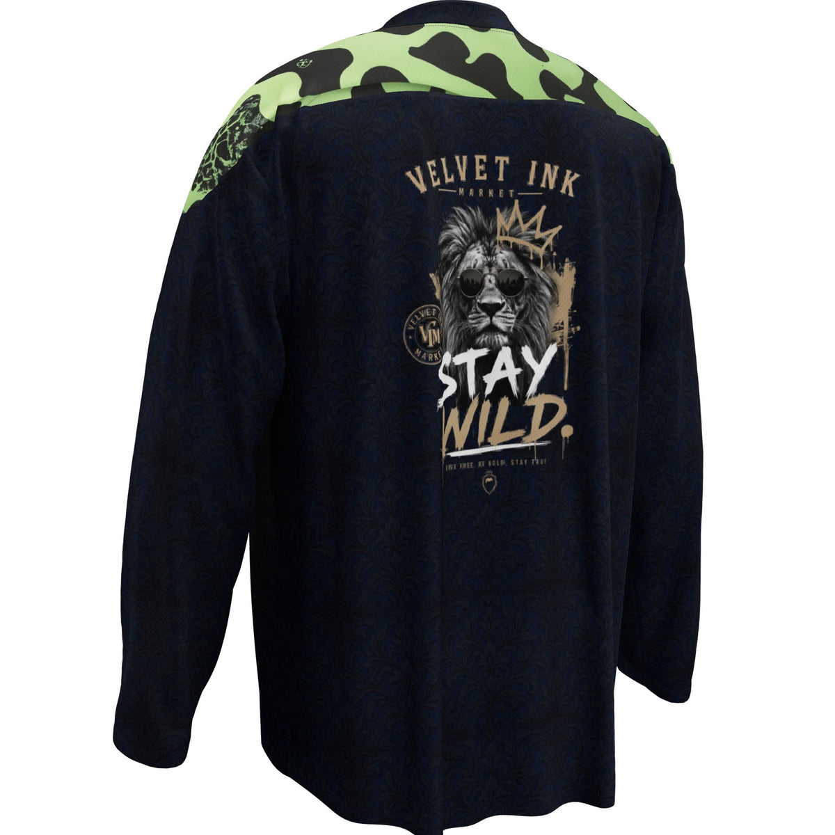 A long-sleeve performance shirt shown from the back, featuring a dark navy body with a green camouflage pattern on the shoulders and upper back, and a large graphic print of a lion and the text 'VELVET INK' and 'STAY WILD.' on the back.