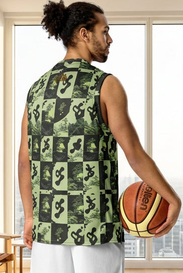 A man shown from the back wearing a sleeveless basketball jersey with a green and black checkerboard graphic pattern, white shorts, and white sneakers, holding a basketball against a plain white background.