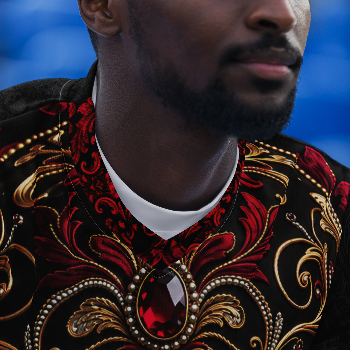 Velvet Ink Market British Roots Dragon Sports Jersey, product photograph featuring red and gold ornament with Viking dragon artwork.