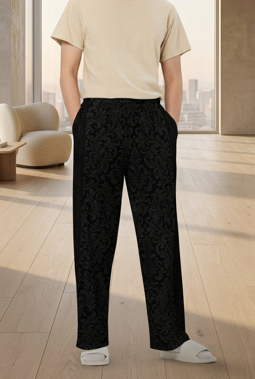 V.I.M Black Damask Wide-Leg Pants with charcoal scrolling foliage, front model view.