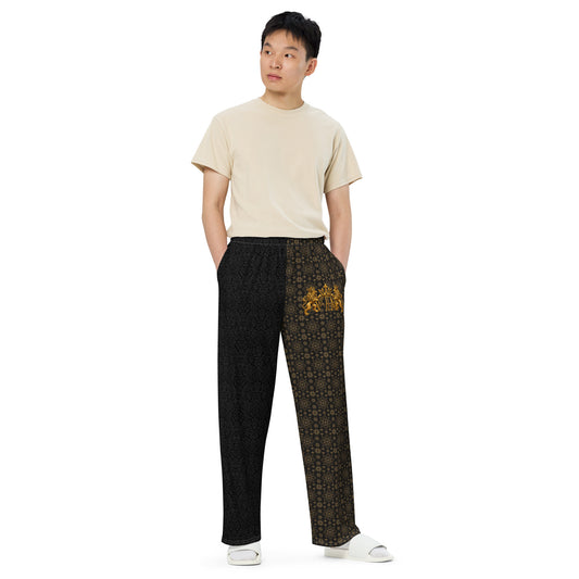 V.I.M Black Leaf & Gold Pattern Wide-Leg Pants, front view with black leaf pattern and gold V.I.M details