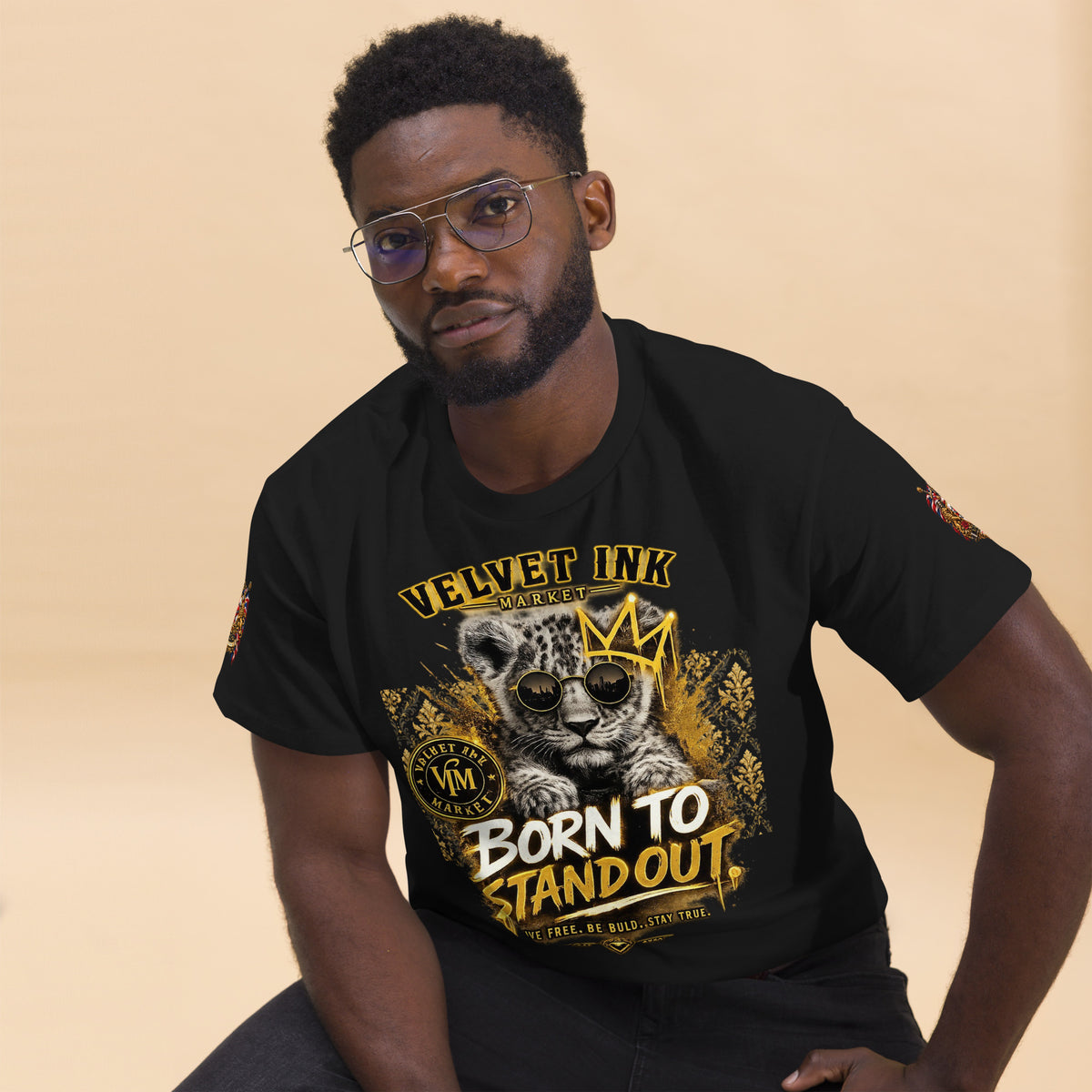 Velvet Ink Market Born To Stand Out Cub T-Shirt in black, front view featuring a lion cub and Born To Stand Out lettering (additional photo 2).