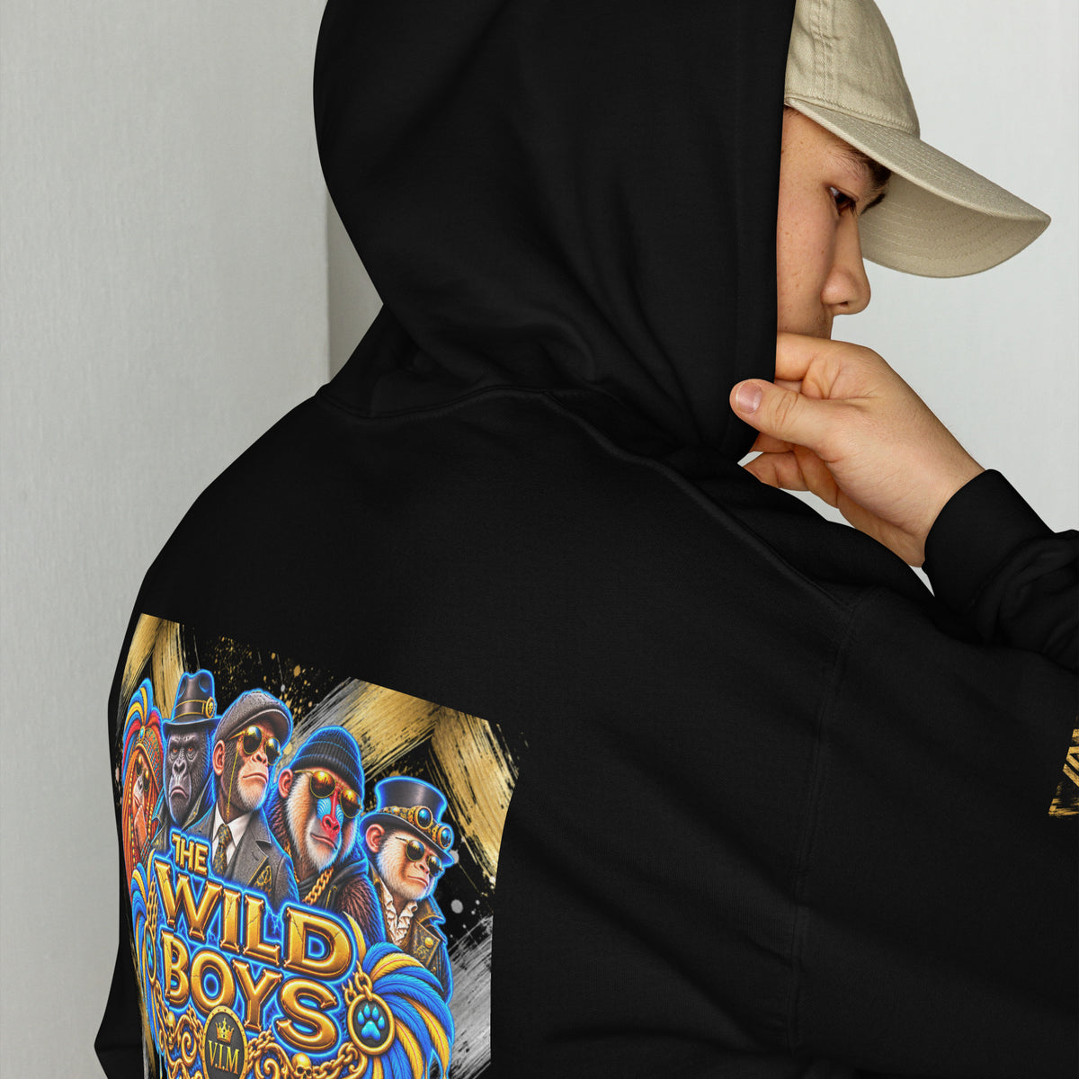 Black Primate hoodie close-up showing three primates and gold-and-blue Wild Boys lettering on the back