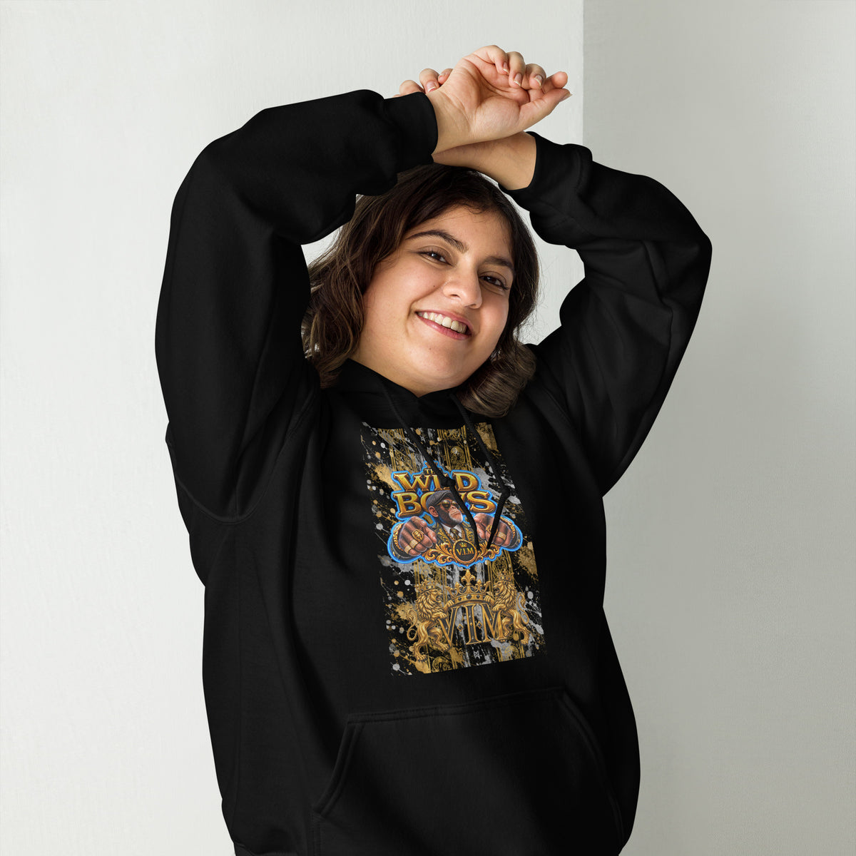 Black Wild Boys Primate hoodie with gold and multicolour chest print, smiling model with raised arms, front view