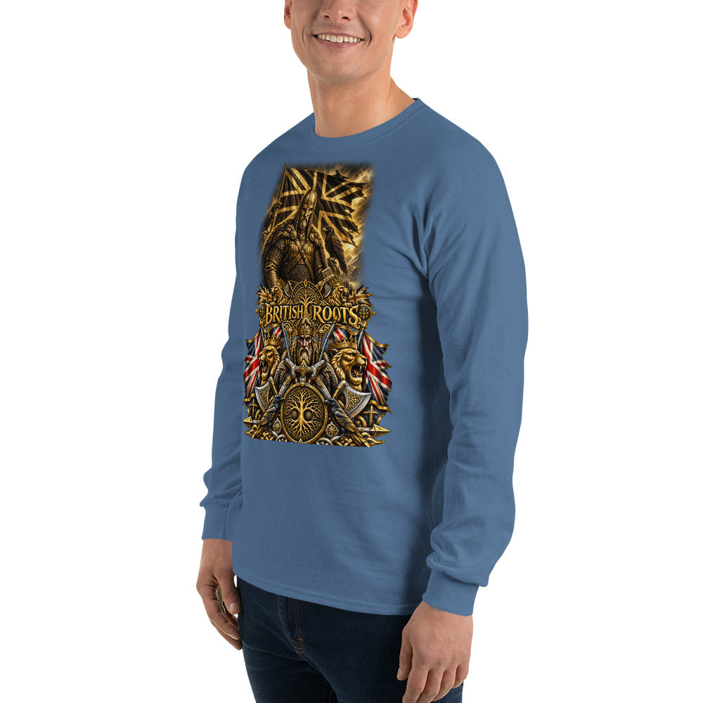 A man wearing a blue long-sleeve t-shirt with a large gold and black graphic on the front that reads 'British Roots', paired with dark jeans, against a plain white background.