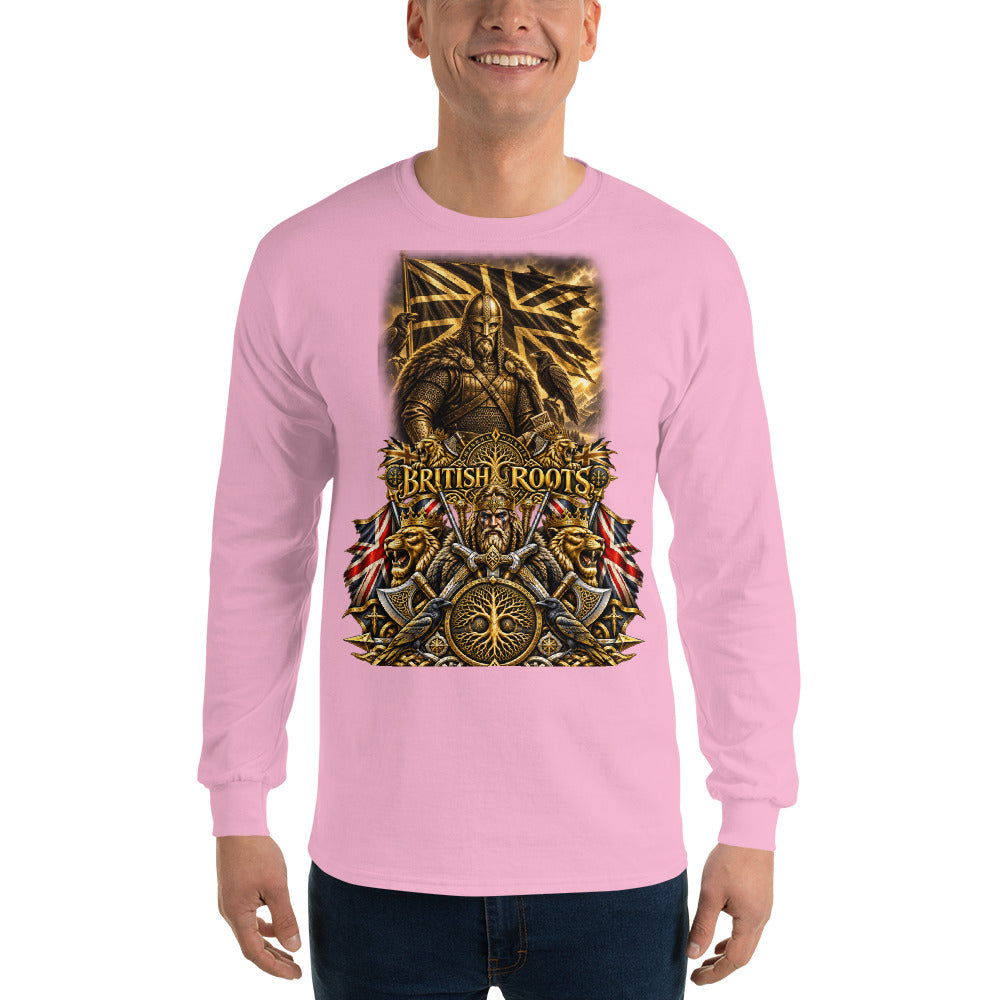 A man wearing a light pink long-sleeve t-shirt with a large, detailed gold and black graphic on the chest featuring the text 'BRITISH ROOTS' and historical military imagery, paired with dark blue jeans against a plain white background.